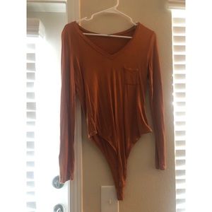 Burnt orange body suit
